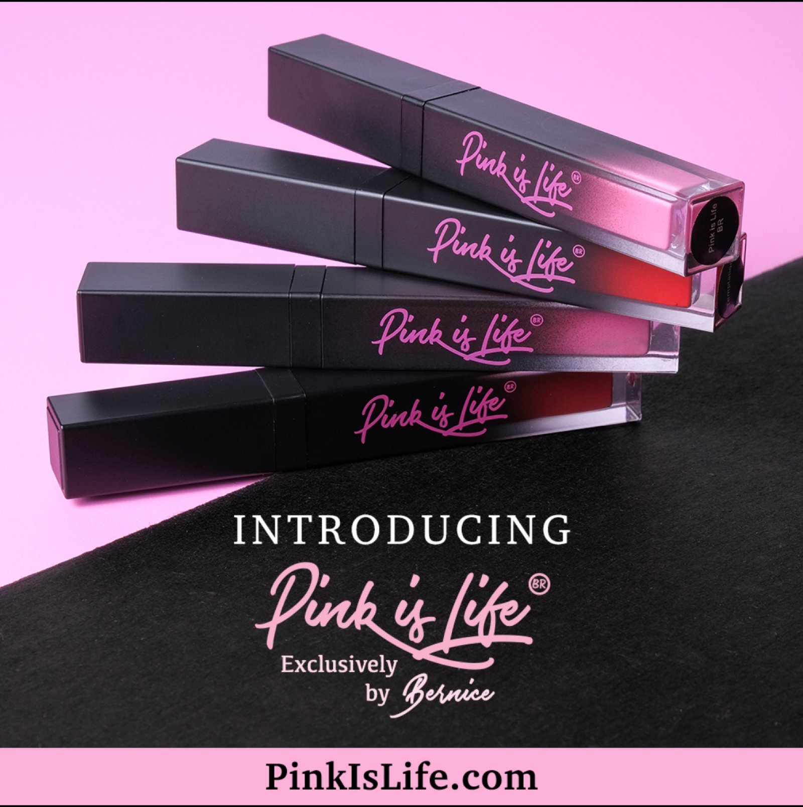 Guilty Pink liquid lipstick tubes stacked on pink and black